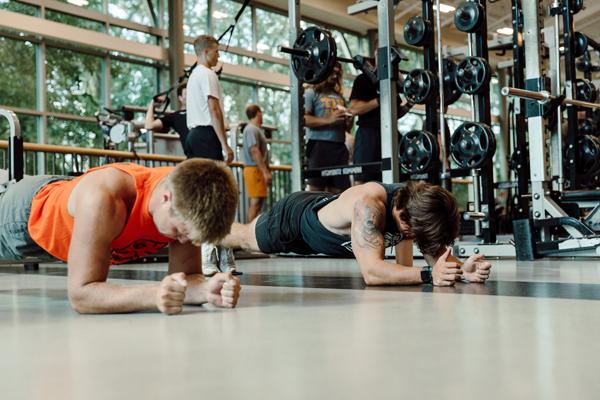 athletes doing pushups in a Doane gym