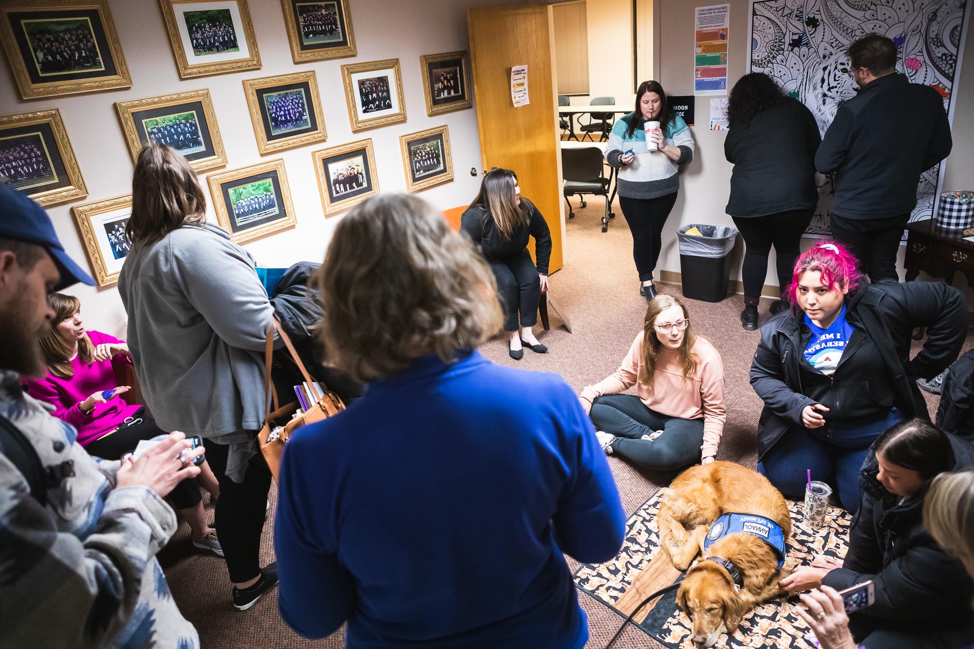 Students and faculty gather and chat before evening classes in the Master of Arts in Counseling building.