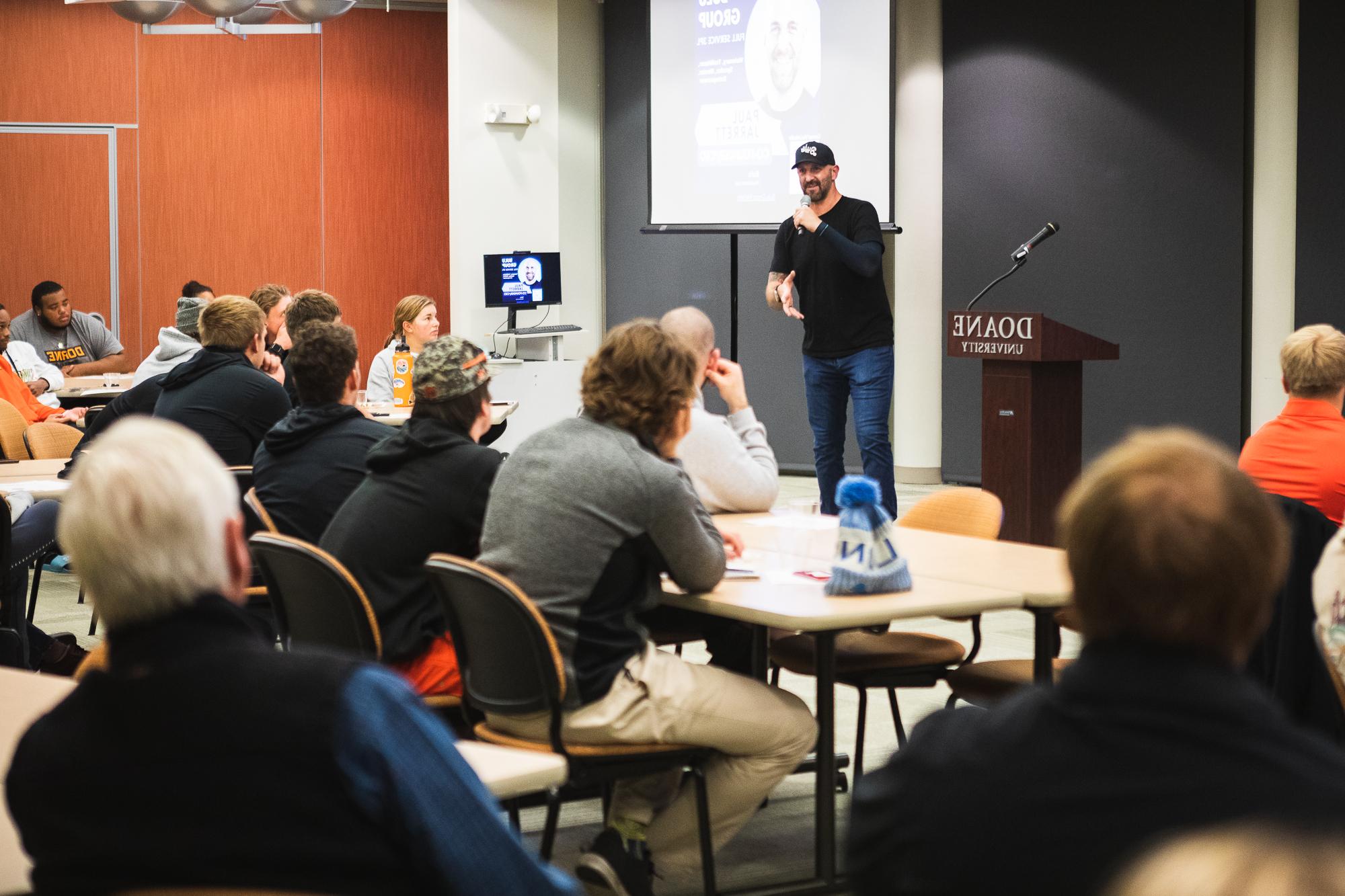 Paul Jarrett, CEO of Bulu, speaks with students inside an Art/Ed classroom.