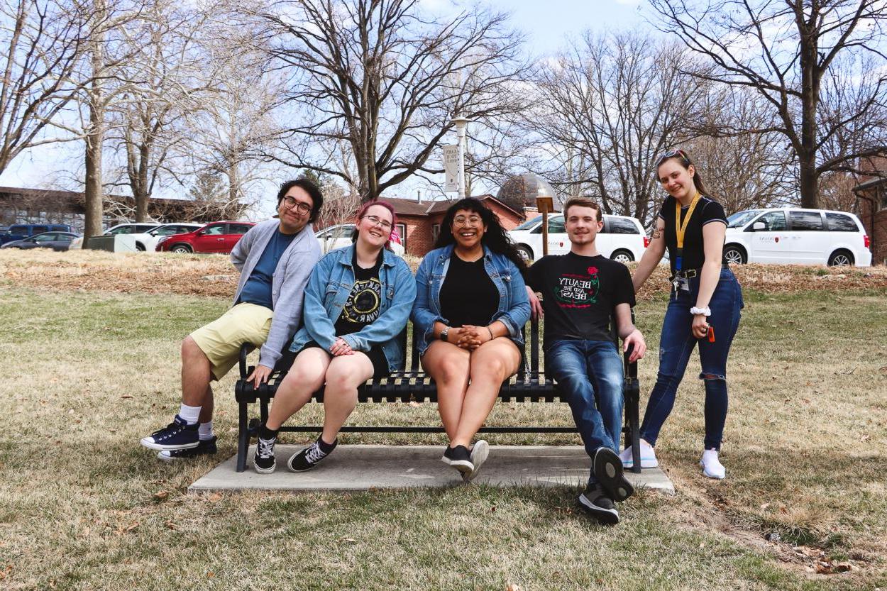 The five members of the Doane Forensics Team pose on a bench on the lawn of the university's Crete campus before leaving for the American Forensics Association National Speech Tournament, held April 1-4 at the University of Nebraska-Lincoln..