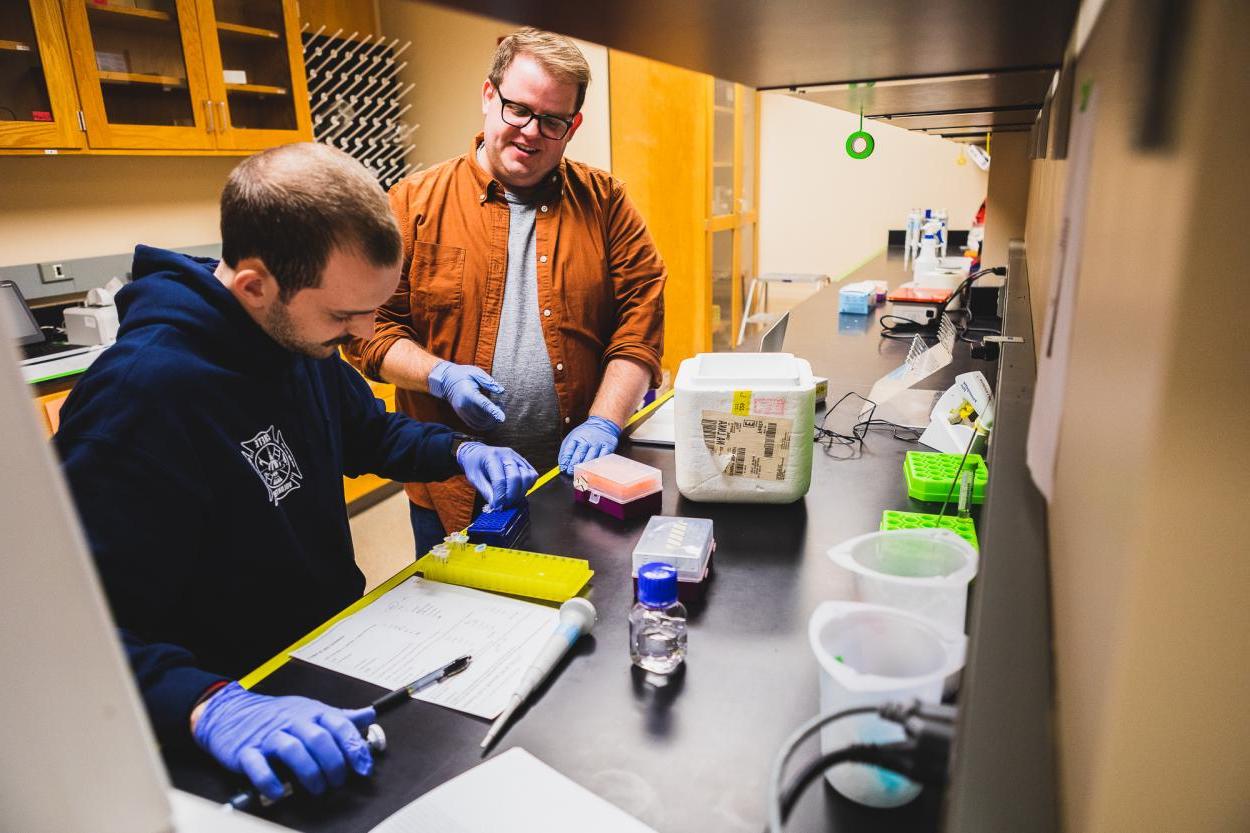 Dr. Dane Bowder, assistant professor of biology, works with a student in one of Doane's lab facilities. 