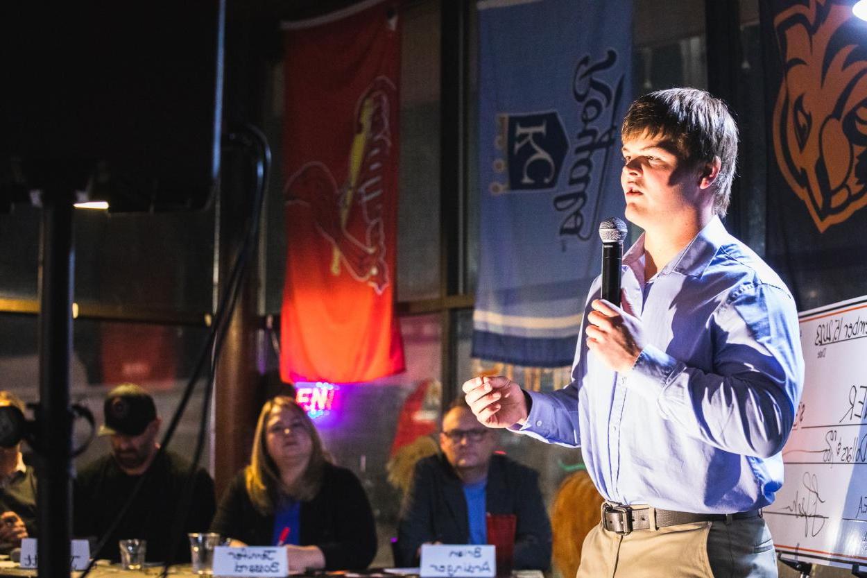 Reece Zutavern speaks into a mic to explain his business idea, MoniTank, a remote system to check cattle tanks. Zutavern presented his idea before a panel of reviewers and to students, staff, faculty and community members at The Big Idea event.