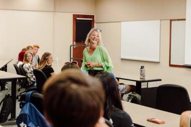 Doane teacher smiling while teaching a class